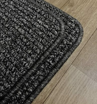 Worn rug edge compared to freshly re-edged rug showing professional overlocking in a Sydney home