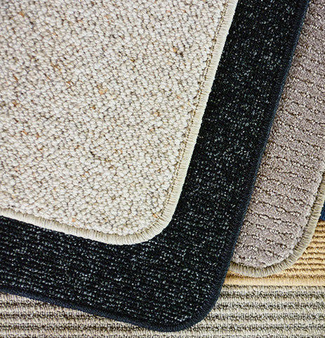 Rug corner curling compared to a flat rug corner after professional overlocking in a Sydney home