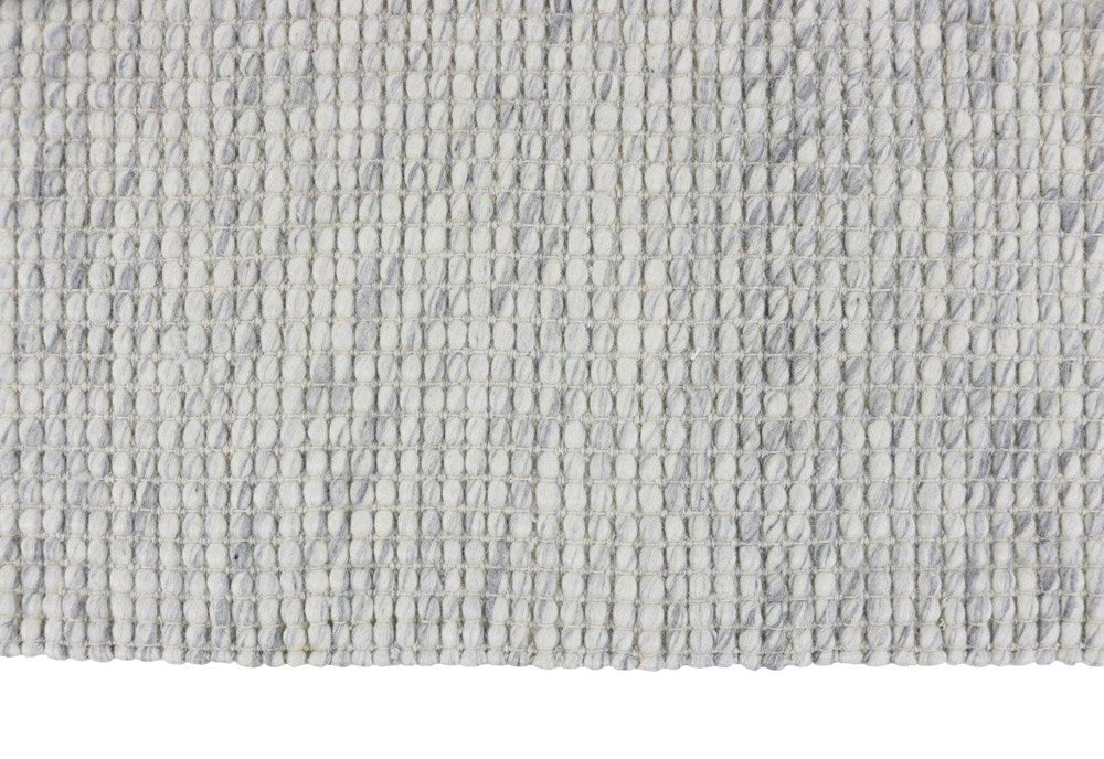 Close-up of a textured gray braided with wool and cotton, shown on a white background, thats available in sydney, australia